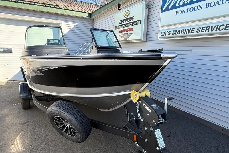 Slide: The Image of 2026 Lund 1775 Impact XS Sport boat on trailer at marine service center. - 8