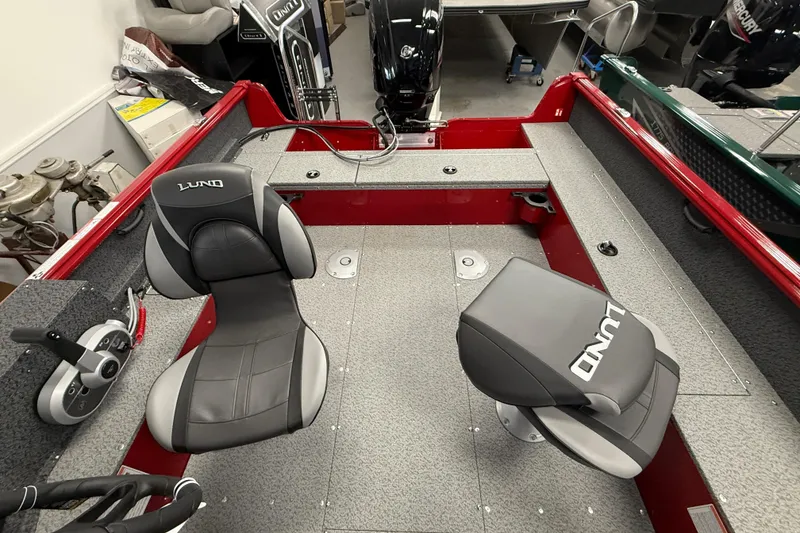 Slide: The Image of 2026 Lund 1700 Explorer SS boat interior with two seats and control panel. - 5