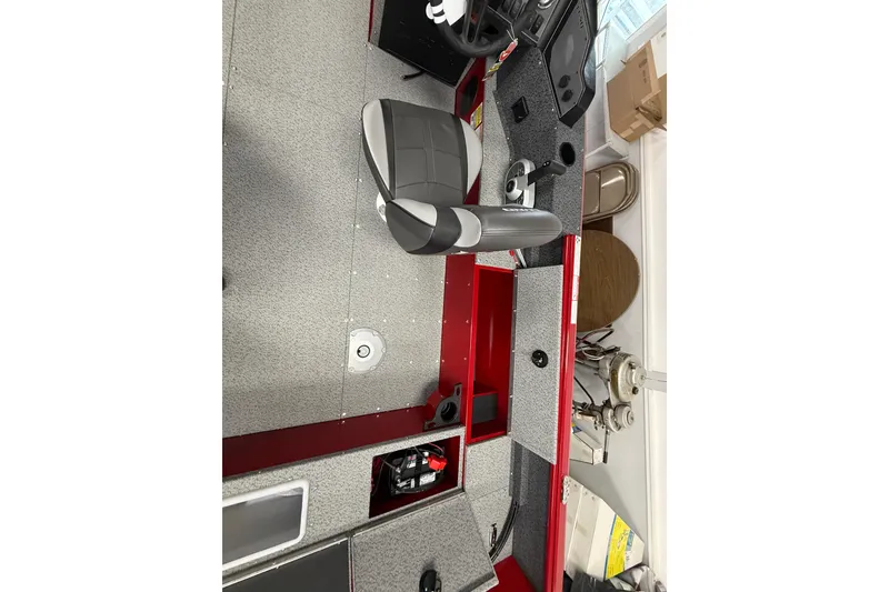 Slide: The Image of Interior of 2026 Lund 1700 Explorer SS boat with gray and red seating and dashboard. - 8