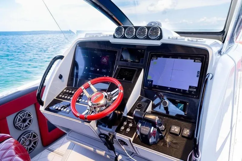 Slide: The Image of Cockpit of 2020 Deep Impact 399 Sport boat with advanced navigation system. - 10