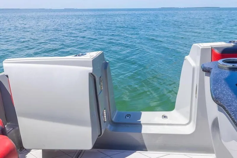 Slide: The Image of 2020 Deep Impact 399 Sport boat with open deck view on the ocean. - 12