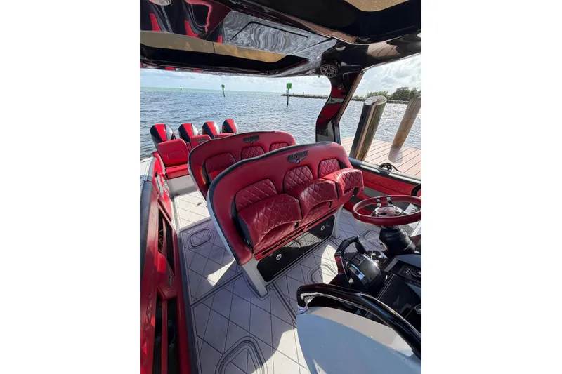 Slide: The Image of Luxurious interior of 2020 Deep Impact 399 Sport boat with red leather seating. - 8