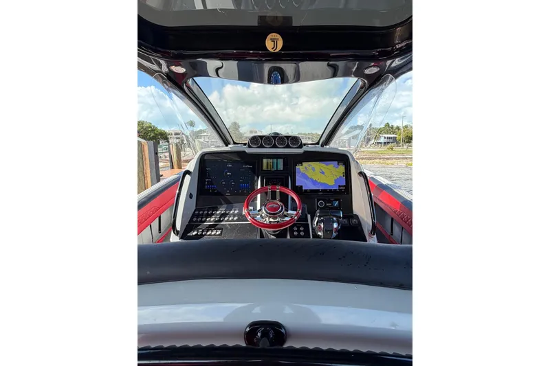 Slide: The Image of Cockpit view of 2020 Deep Impact 399 Sport boat with advanced navigation system. - 9