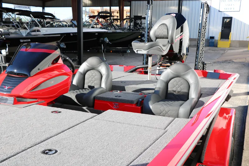 Slide: The Image of 2026 Vexus AVX 2080 boat with red accents and comfortable seating. - 12