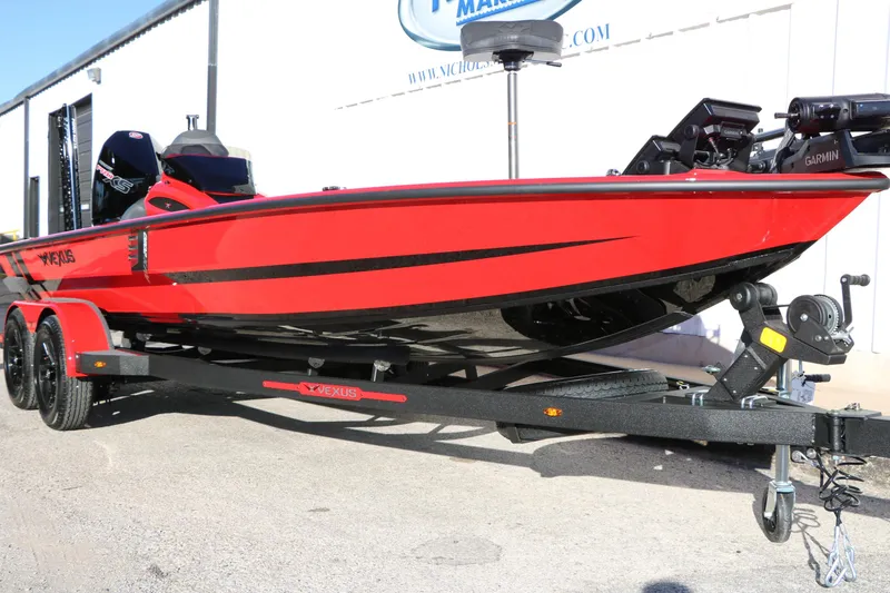 Slide: The Image of 2026 Vexus AVX 2080 red boat on trailer, featuring Garmin equipment. - 2