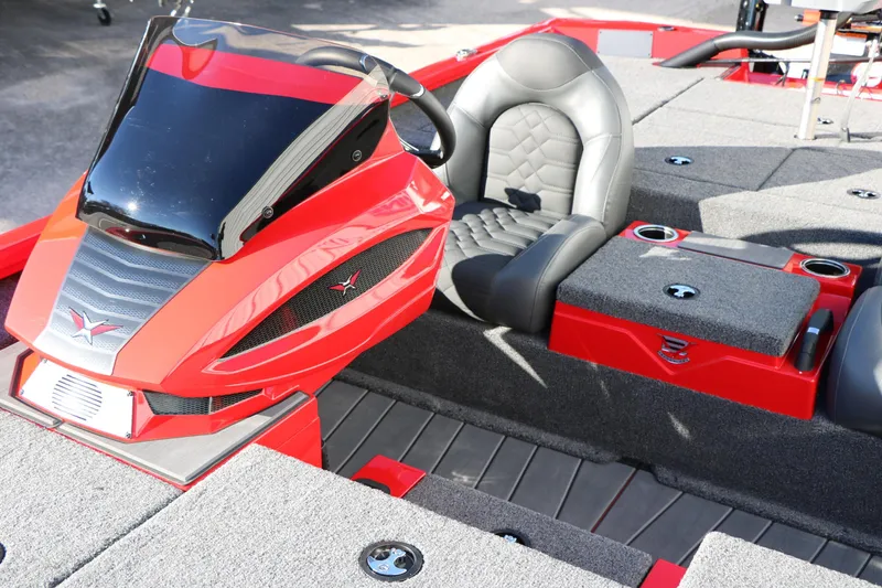 Slide: The Image of 2026 Vexus AVX 2080 boat interior with red and gray seating and console. - 26