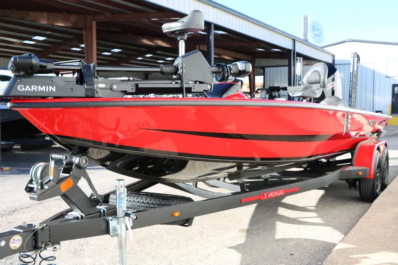 Slide: The Image of 2026 Vexus AVX 2080 red fishing boat with Garmin equipment on trailer. - 4