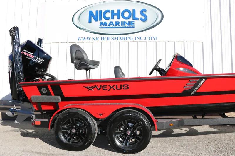 Slide: The Image of 2026 Vexus AVX 2080 boat in vibrant red at Nichols Marine dealership. - 7