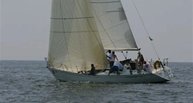 Slide: The Image of 1985 Beneteau First 42 sailboat on the ocean. - 1