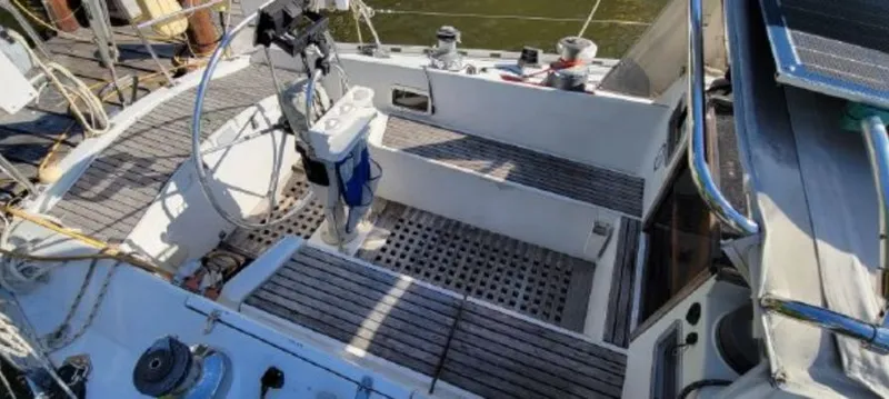 Slide: The Image of Cockpit of a 1985 Beneteau First 42 sailboat with wooden decks. - 10
