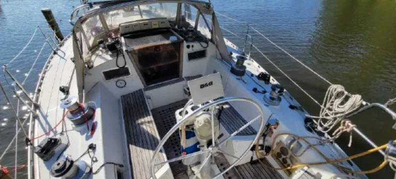 Slide: The Image of Cockpit of a 1985 Beneteau First 42 yacht on calm water. - 11