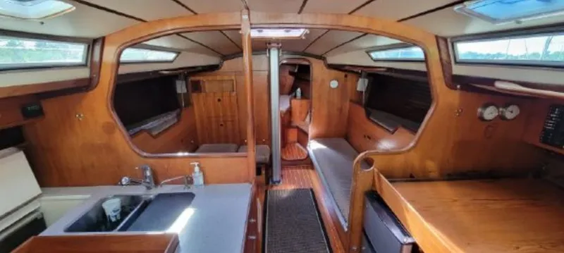 Slide: The Image of Interior of a 1985 Beneteau First 42 yacht with wooden finish. - 14