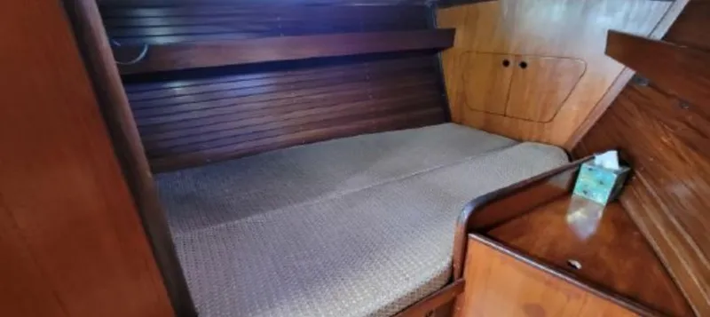 Slide: The Image of Interior of a 1985 Beneteau First 42 yacht with wooden finish. - 16