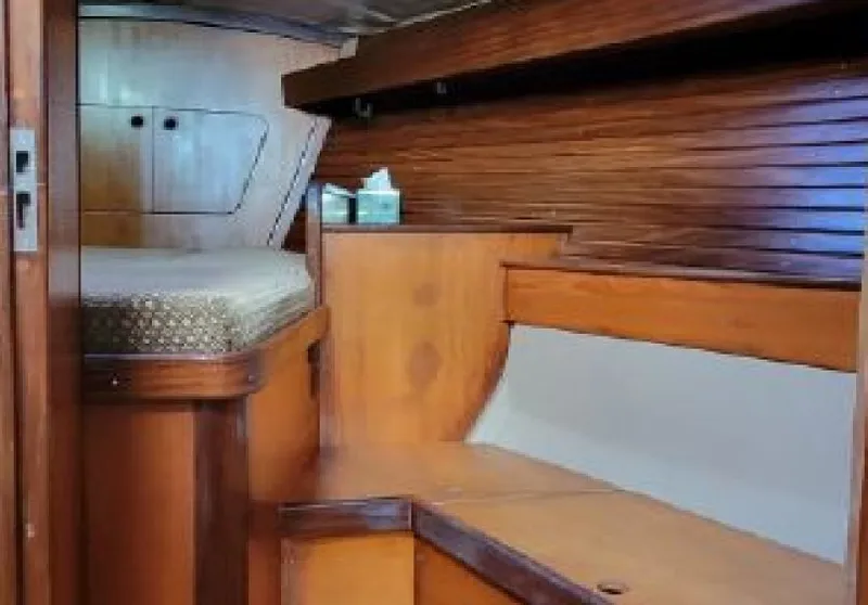 Slide: The Image of Interior of a 1985 Beneteau First 42 yacht, featuring wood finish. - 17