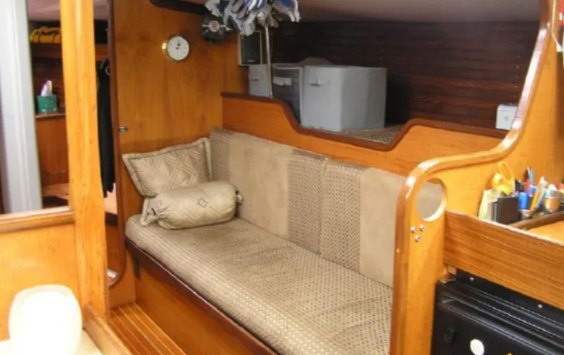 Slide: The Image of Interior of a 1985 Beneteau First 42 yacht with cozy sofa. - 20