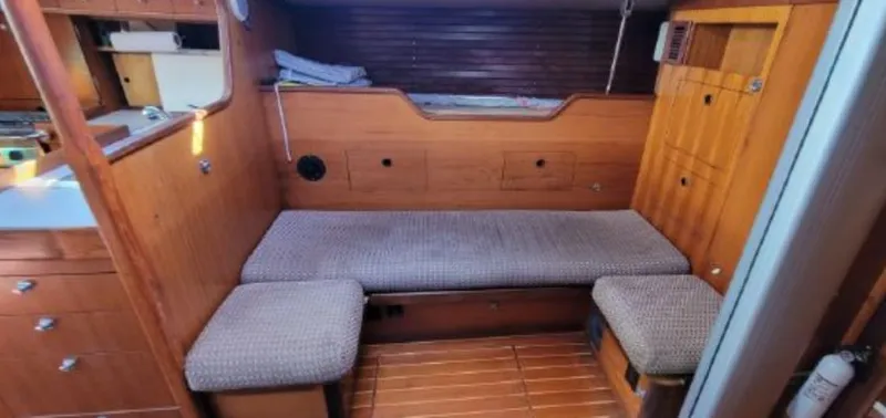 Slide: The Image of Interior of a 1985 Beneteau First 42 yacht with wooden furnishings. - 23