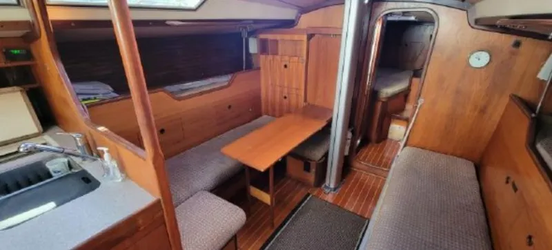 Slide: The Image of Interior of a 1985 Beneteau First 42 yacht with wooden furnishings. - 24