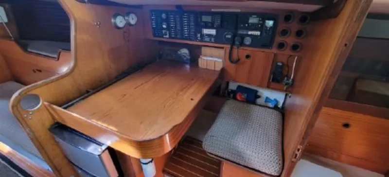 Slide: The Image of Interior of a 1985 Beneteau First 42 yacht with navigation area. - 25