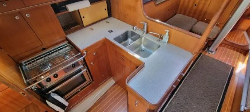 Slide: The Image of Interior view of a 1985 Beneteau First 42 yacht kitchen. - 28