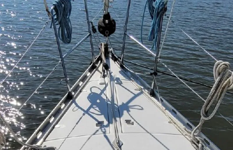Slide: The Image of Deck of a 1985 Beneteau First 42 sailboat on the water. - 3