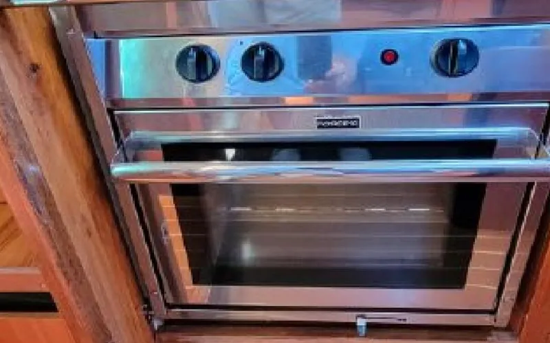 Slide: The Image of Stainless steel oven in a 1985 Beneteau First 42 yacht. - 31