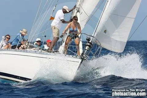 Slide: The Image of 1985 Beneteau First 42 sailboat navigating through ocean waves. - 39