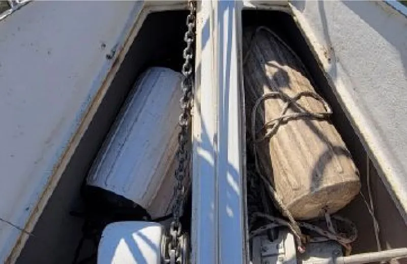 Slide: The Image of Anchor locker of a 1985 Beneteau First 42 with fenders. - 4