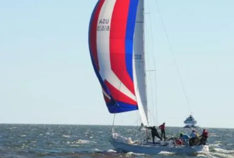 Slide: The Image of 1985 Beneteau First 42 sailboat on open sea. - 41