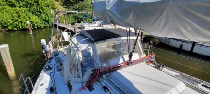 Slide: The Image of 1985 Beneteau First 42 sailboat docked on a sunny day. - 9