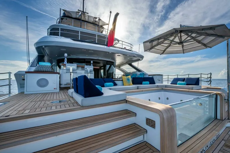 Slide: The Image of Luxurious 2023 Benetti Oasis 34M yacht deck with jacuzzi and seating area. - 13