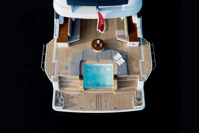 Slide: The Image of Aerial view of 2023 Benetti Oasis 34M yacht deck with jacuzzi and seating area. - 14