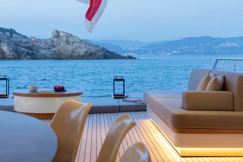 Slide: The Image of Luxurious 2023 Benetti Oasis 34M yacht deck with ocean view and elegant seating. - 19