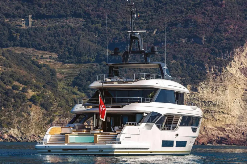Slide: The Image of Luxury yacht Benetti Oasis 34M Co Ownership 2023 on scenic coastal waters. - 21