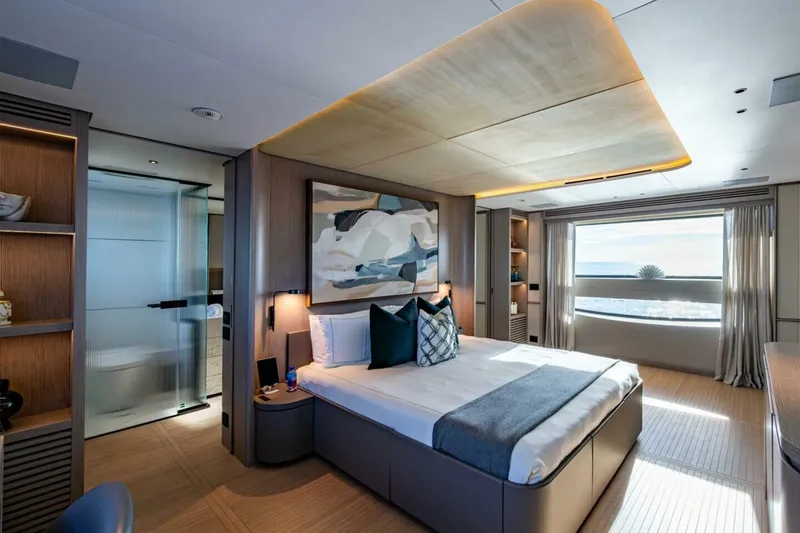 Slide: The Image of Luxurious bedroom interior of 2023 Benetti Oasis 34M Co Ownership yacht, featuring modern design and ocean view. - 24