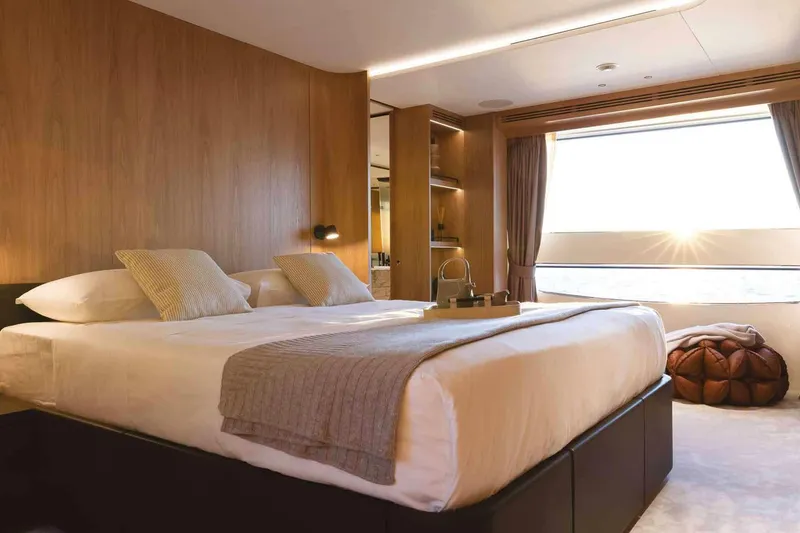Slide: The Image of Luxurious bedroom interior on 2023 Benetti Oasis 34M Co Ownership yacht, featuring elegant design. - 25