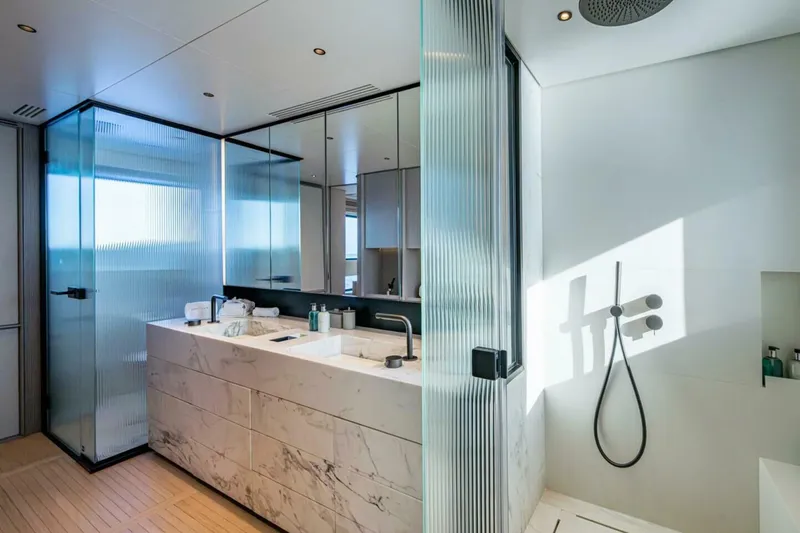 Slide: The Image of Luxurious bathroom on 2023 Benetti Oasis 34M yacht, featuring marble sink and modern shower. - 27