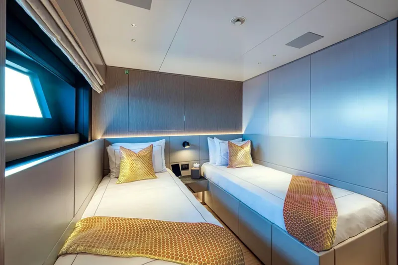 Slide: The Image of Luxurious twin cabin on 2023 Benetti Oasis 34M yacht, featuring modern design and elegant decor. - 31