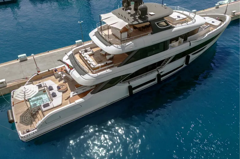 Slide: The Image of Luxurious 2023 Benetti Oasis 34M Co Ownership yacht docked in serene blue waters. - 33