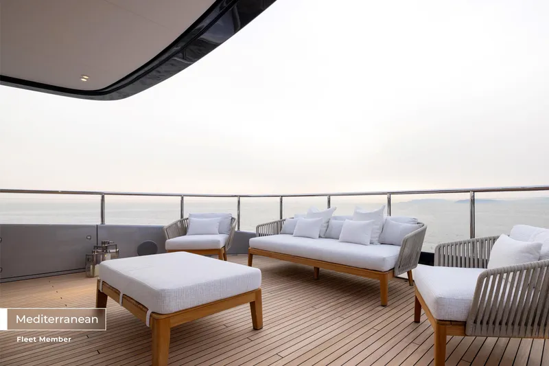 Slide: The Image of Luxurious deck of 2023 Benetti Oasis 34M yacht with elegant seating and ocean view. - 42