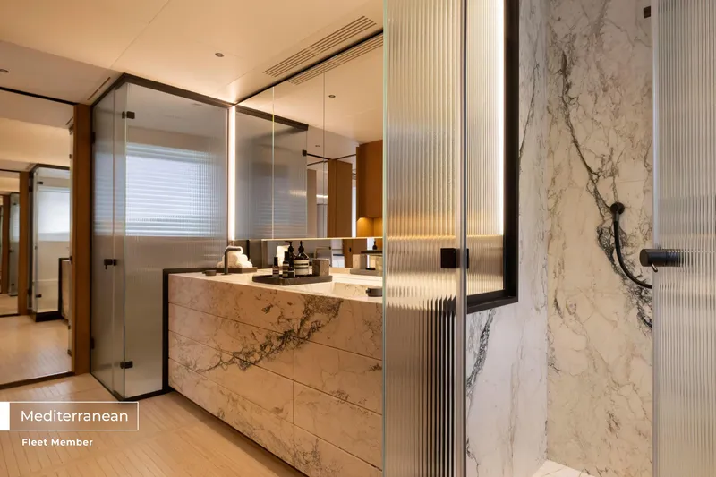 Slide: The Image of Luxurious bathroom on 2023 Benetti Oasis 34M yacht, featuring marble and modern design elements. - 46