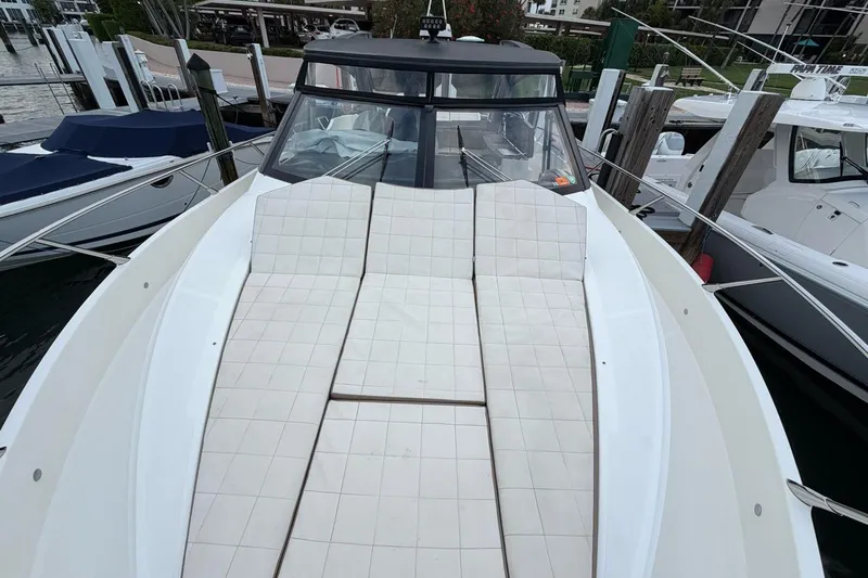 Slide: The Image of 2019 Absolute 40 SLT yacht cruising on calm waters, aerial view. - 2
