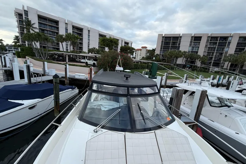 Slide: The Image of Cockpit of 2019 Absolute 40 SLT yacht with modern navigation controls and steering wheel. - 3