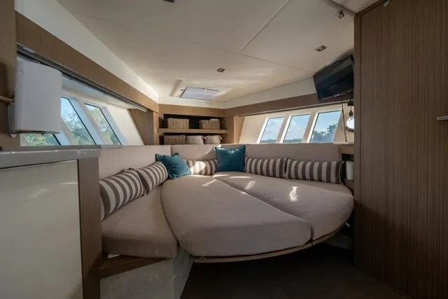 Slide: The Image of Luxurious interior of 2019 Absolute 40 SLT yacht with circular seating and modern decor. - 32