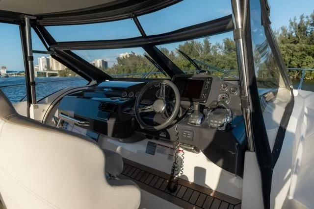 Slide: The Image of Cockpit of 2019 Absolute 40 SLT yacht with modern controls and scenic water view. - 33