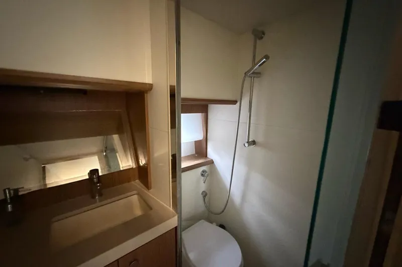 Slide: The Image of Modern kitchen with sleek induction cooktop on Absolute 40 SLT, 2019 model. - 19