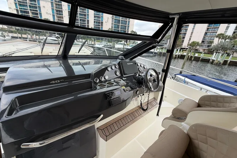 Slide: The Image of Luxurious interior of 2019 Absolute 40 SLT yacht with elegant seating and panoramic windows. - 23