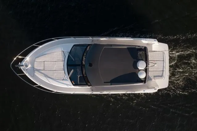 Slide: The Image of Luxurious 2019 Absolute 40 SLT yacht with spacious sunbathing deck by the water. - 26
