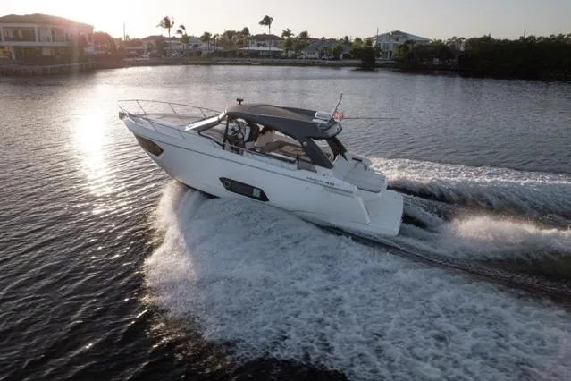 Slide: The Image of Luxurious 2019 Absolute 40 SLT yacht interior with elegant seating and scenic waterfront view. - 39