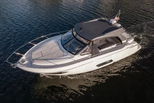 Slide: The Image of 2019 Absolute 40 SLT luxury yacht cruising on calm waters. - 42