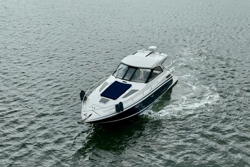 Slide: The Image of 2017 Regal 35 Sport Coupe cruising on open water. - 2